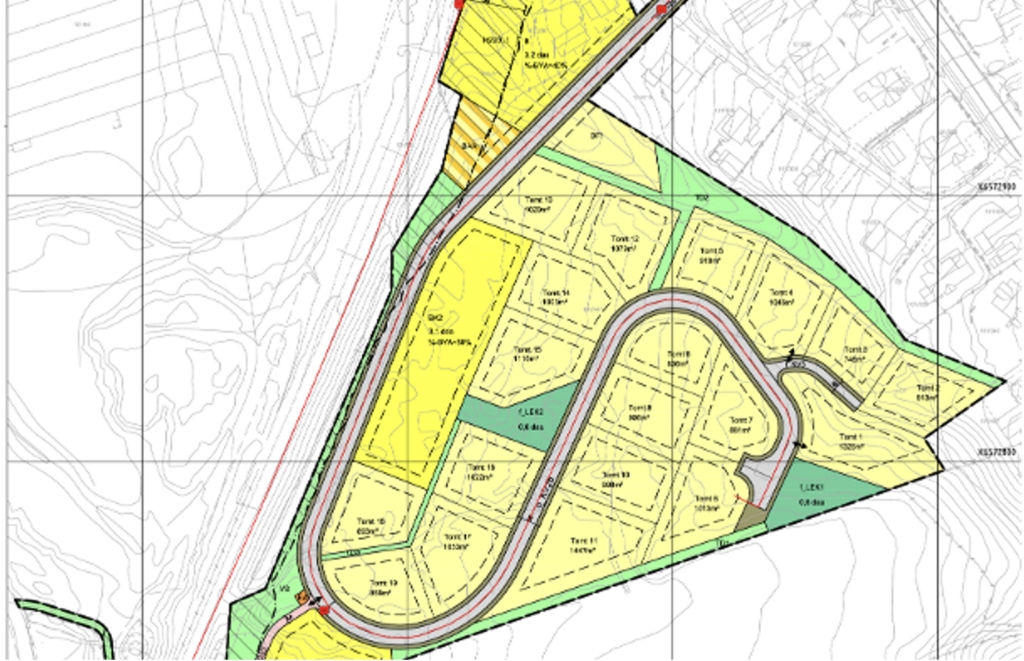 Color-coded site plan showing subdivided lots, roads, and green spaces around a curved road for a development project.